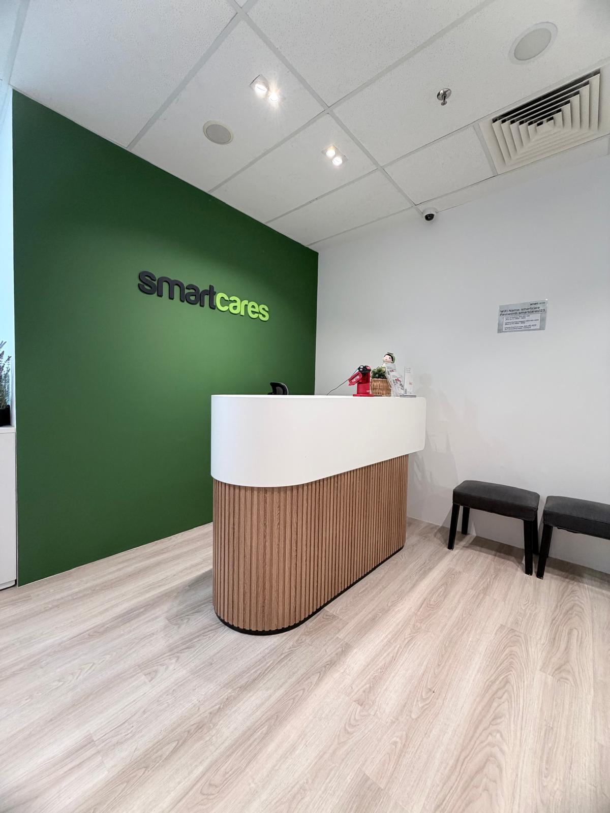 Side angle showing the curved corner detail of a timber fluted reception desk.