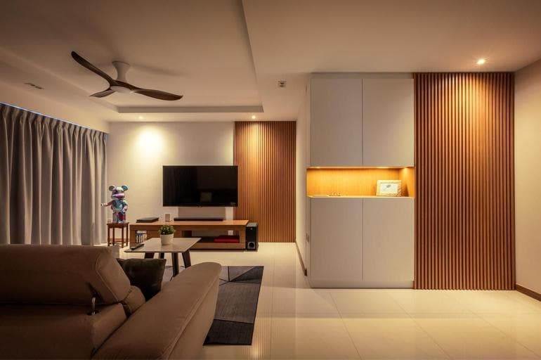 Residential renovation project featuring contemporary living room interior design with wood fluted paneling in Singapore